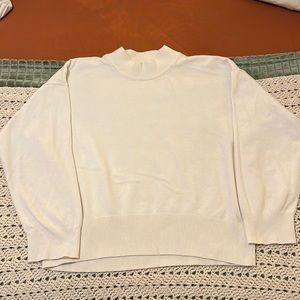 White mock-neck sweater